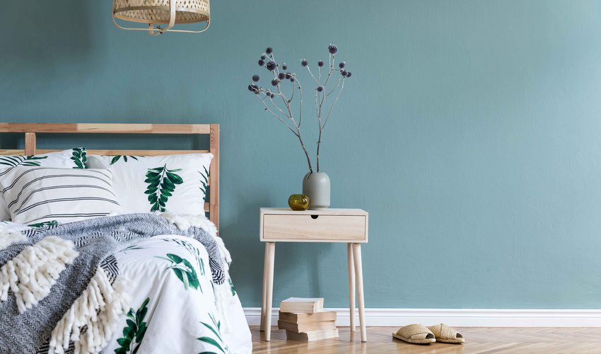Minimalistic-composition-of-bedroom-interior-with-wooden-bed