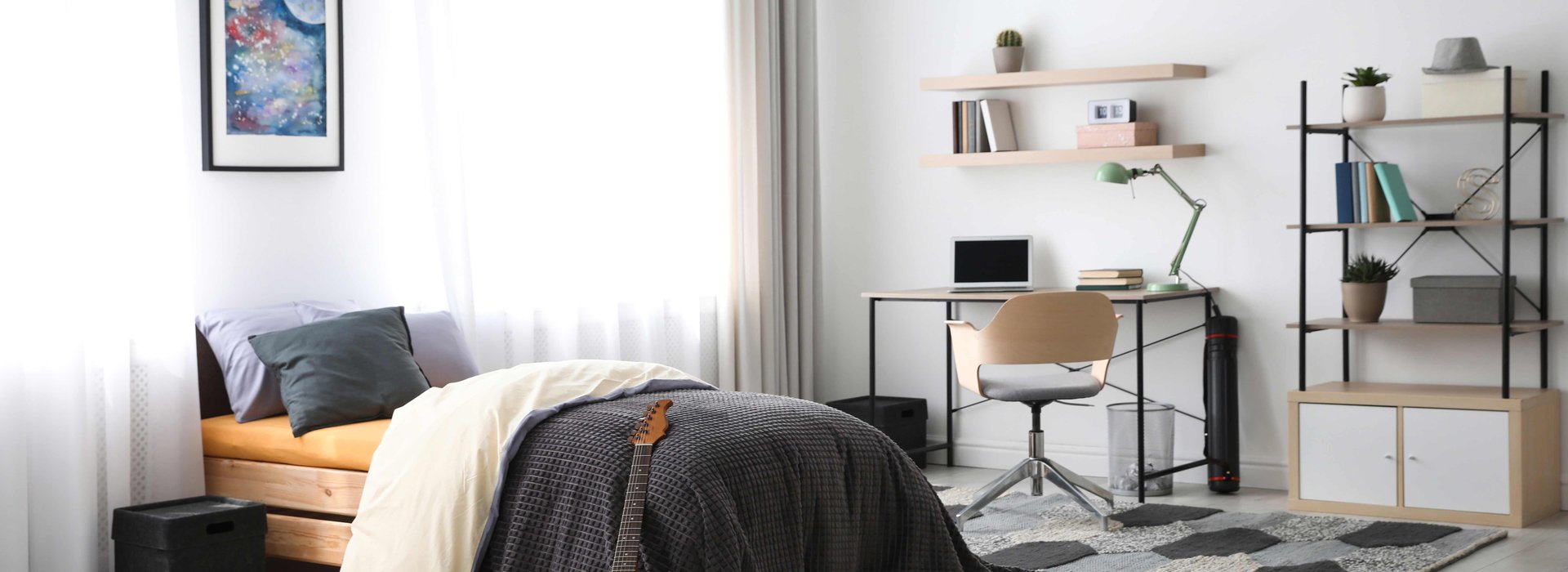 Modern teenager's room interior with workplace and bed